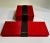 Boxed Set of Four Walai Orange accented Crimson Red Silk Folded Placemats and Napkins. Featuring boxed Black Silk backed...