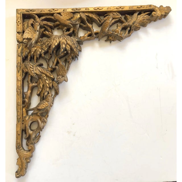 Deeply hand carved gilt wood brackets a corner, together in an entry or hanging on a wall as art. Though this is a pair...