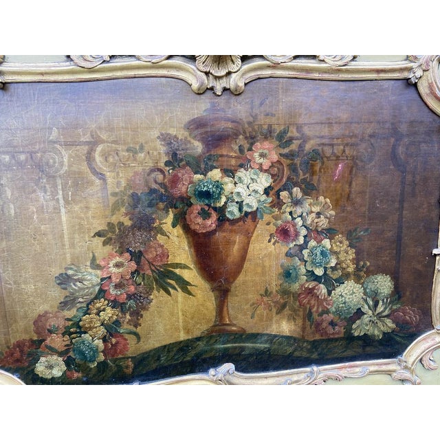 Painted and gilded French trumeau mirror featuring a romantic oil painting, circa 1780-1820.