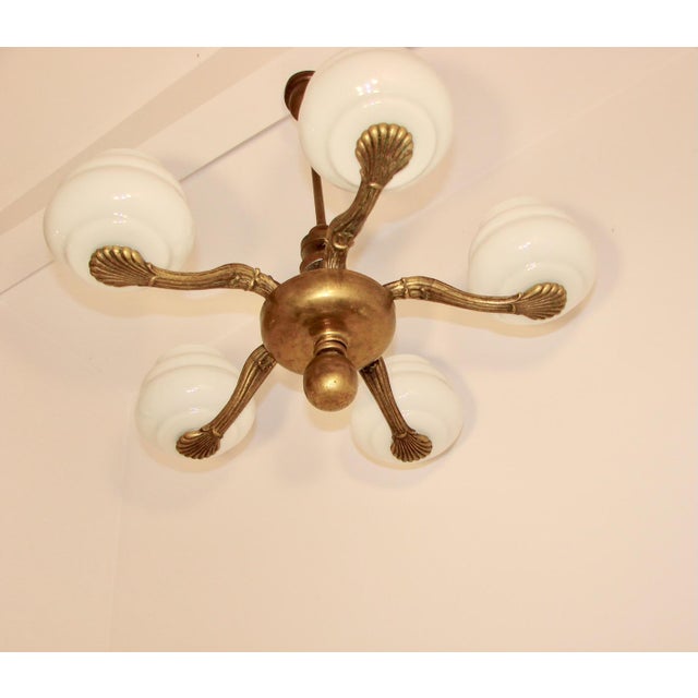 Chandelier in Brass and Glass, 1930s-1940s, in Good conditions. Designed 1920 to 1949 Up to 250V (Europe/UK Standard).The...