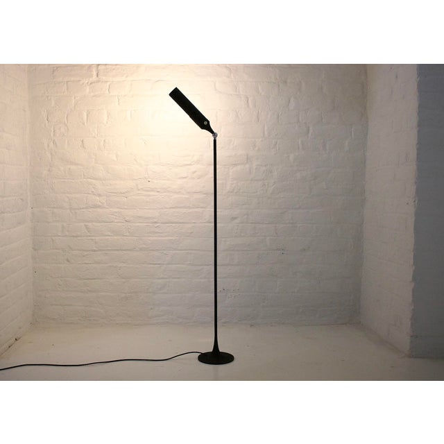 Model 1086 reading lamp by Gino Sarfatti, produced by Arteluce around 1961. Tubular structure resting on a slender tulip...