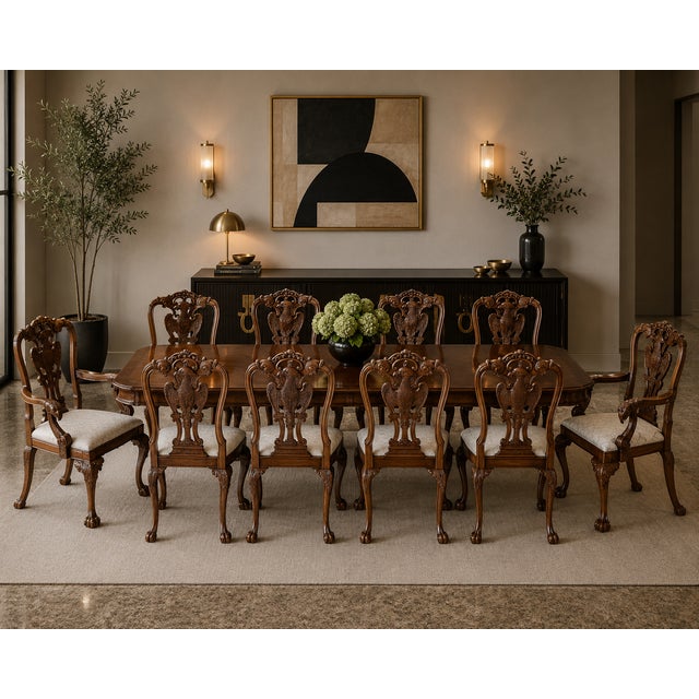 Commanding, sculptural, and richly detailed — this set of 8 hand-carved Phoenix-back dining chairs makes a dramatic...