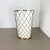 This original vintage Minimalist umbrella stand was produced in the 1950s in Germany by Vereinigte Werkstätten München. It...