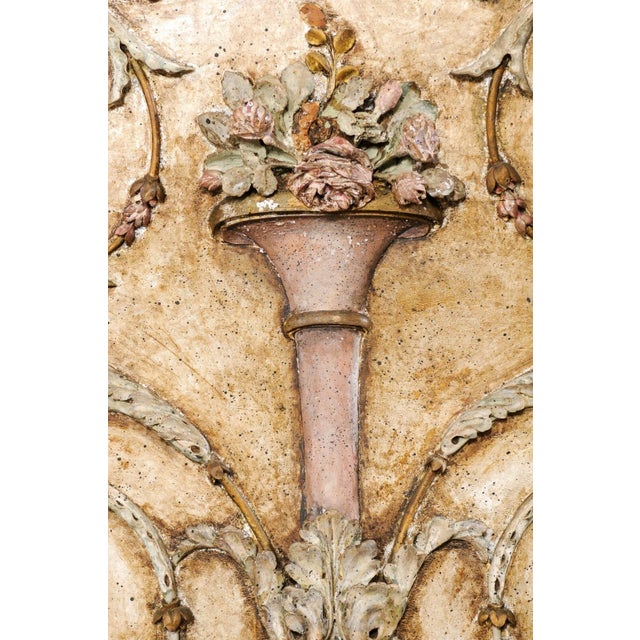 A French carved-wood wall plaque from the early 19th century. This antique wall decoration from France features the...