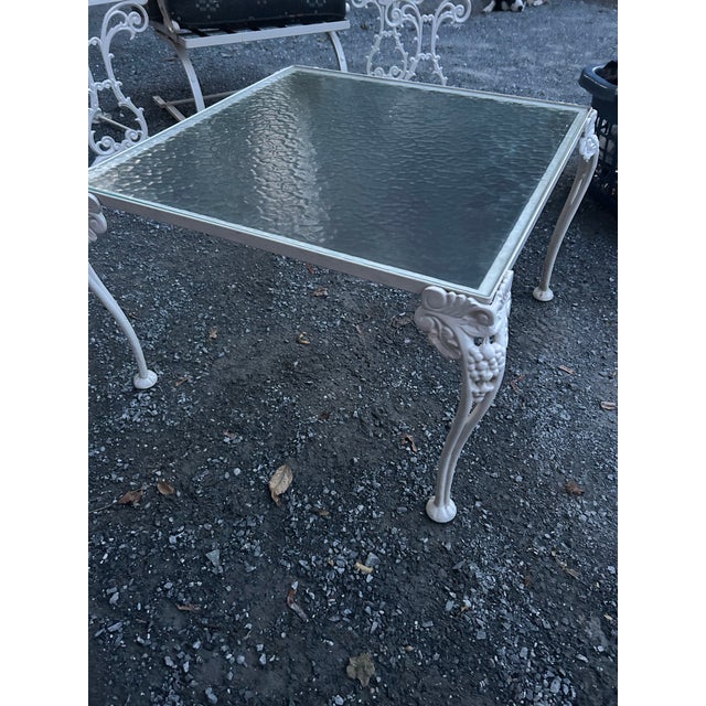 A striking piece of classic mid-century garden Americana, this vintage Woodard-style wrought iron coffee table features an...