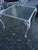 A striking piece of classic mid-century garden Americana, this vintage Woodard-style wrought iron coffee table features an...