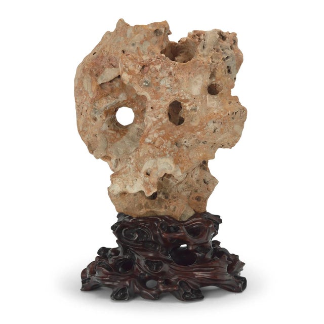 Spectacular Chinese 'Taihu' scholar's stone. Naturally formed limestone mounted on gorgeous carved hardwood stand....