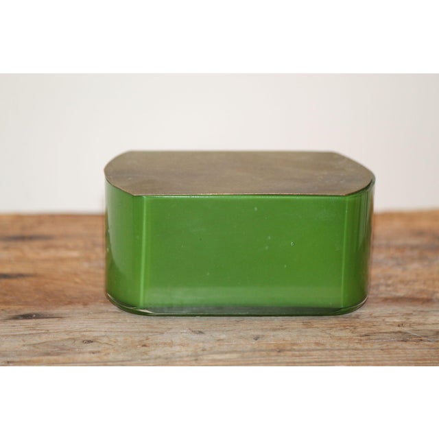 This is a lovely antique green opaque glass dresser box w/ a hinged brass lid, made around 1900. Unmarked, the glass is a...