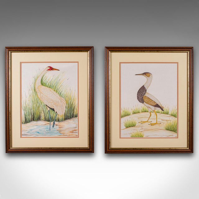 This is a pair of antique bird paintings. An English, framed silk art, dating to the late Victorian period, circa 1900....