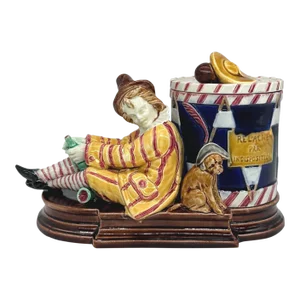A Sarreguemines Majolica Smoking Stand, Drunk Street Musician and Dog, Ca. 1880
