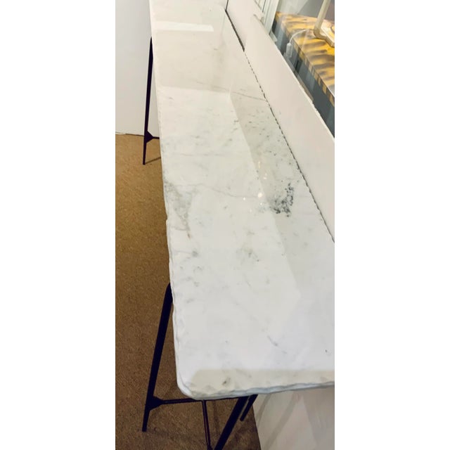 Stylish Modern White and Gray Marble Console Table, textured edge, copper finished metal base, showroom floor sample