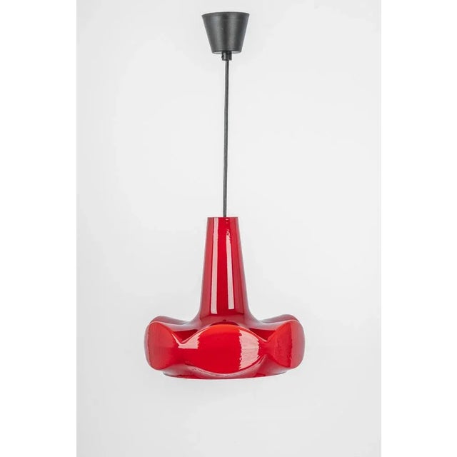 Petite red glass pendant light by peill & putzler, manufactured in germany, circa the 1970s. High quality and in very good...