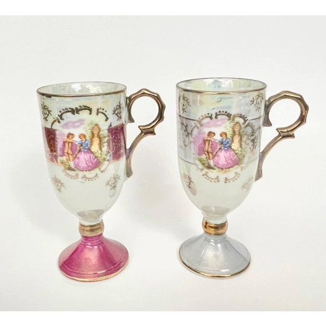 Set of 2 vintage demitasse cups by Royal Vienna. These elegant footed cups feature iridescent lusterware glaze, gold trim,...