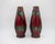 An antique English Secessionist Ware vase pair from Minton's of Stoke-on-Trent, Staﬀordshire. These striking art pottery...