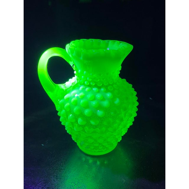 Selling this Vintage Fenton Hobnail Uranium Glass Pitcher. Real uranium which glows under UV light (shown in first...