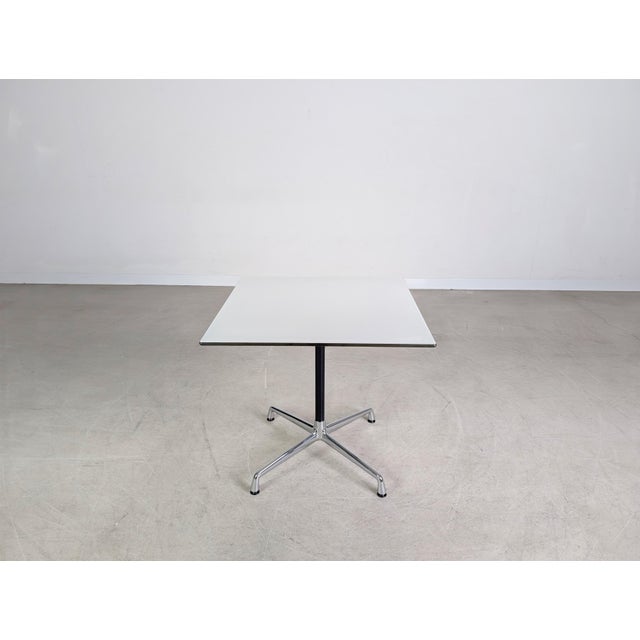 Beautiful square dining table by Vitra for sale. The "segmented table" model was designed by Charles & Ray Eames and is...