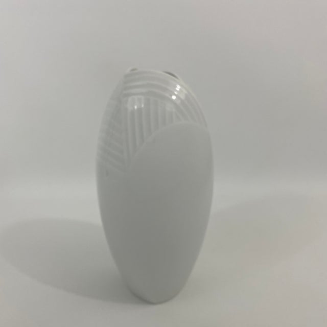 Snow white glazed Meissen porcelain vase. The vase has very graceful shape with beautiful embossed pattern modern pattern...