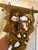 A striking pair of vintage giltwood wall brackets featuring ornate Rococo-inspired carving with scrolling acanthus leaves,...