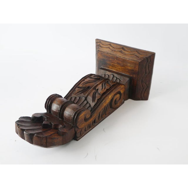 An antique wood carved small wall console with nice details and shape. This hand crafted piece can be hanged on the wall...