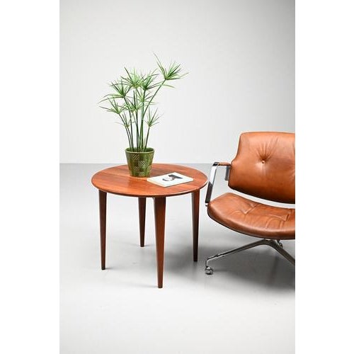 A. Mikael Laursen side or coffee table made of solid teak wood. Laursen is the Danish (Aarhus) manufacturer of this Mid...