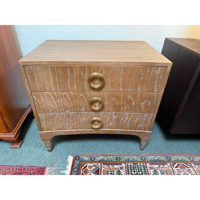 Design Plus Gallery presents the Atherton Teak Nightstand by Brownstone Furniture. This three-drawer bedside table has a...