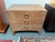 Design Plus Gallery presents the Atherton Teak Nightstand by Brownstone Furniture. This three-drawer bedside table has a...