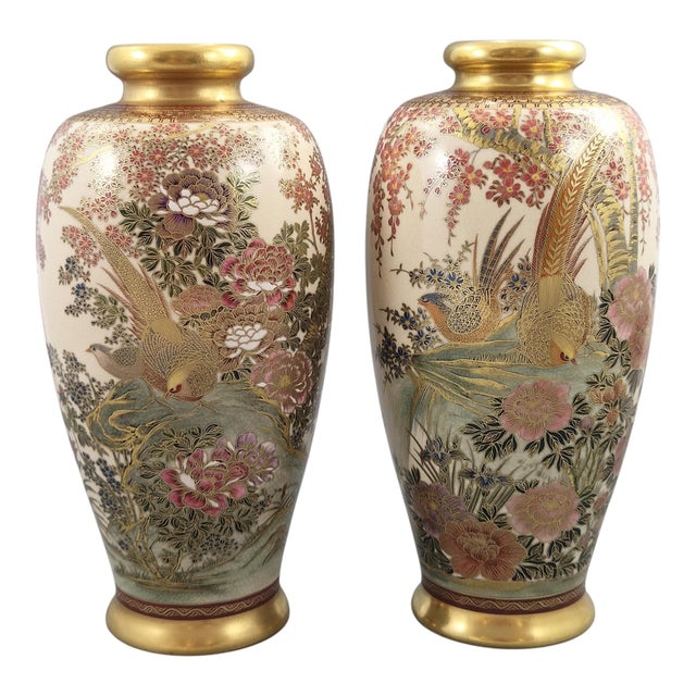 An elegant and richly decorated pair of Japanese Satsuma vases, signed for Manpei, Kobe, Japan, and dating to the early...