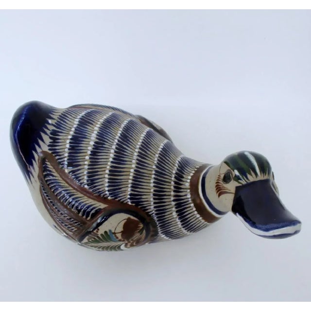 Tonalá ceramic duck figure by Mexican artist Mateos, with detailed hand-painted traditional designs. Hand signed by the...