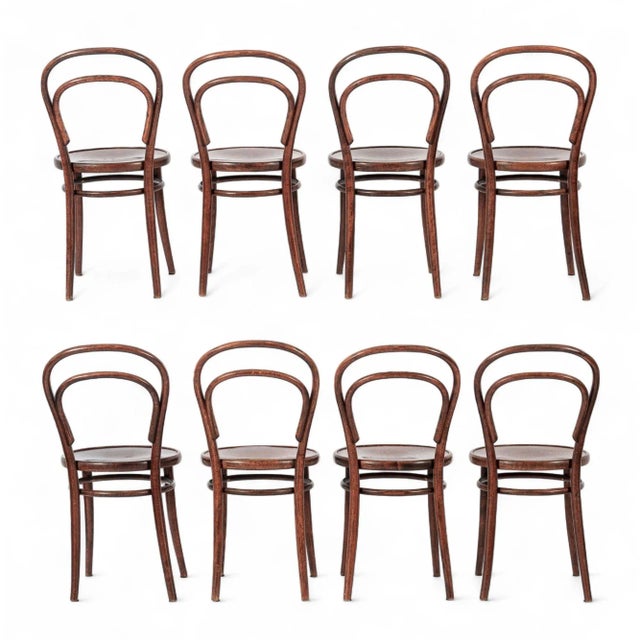 This set of eight vintage mid century bentwood No. 14 cafe bistro dining chairs were made in Czechoslovakia by Drevounia...