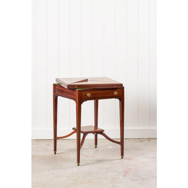 Edwardian envelope card table with a swivel top that unfolds to reveal a green felt playing surface with built-in corner...
