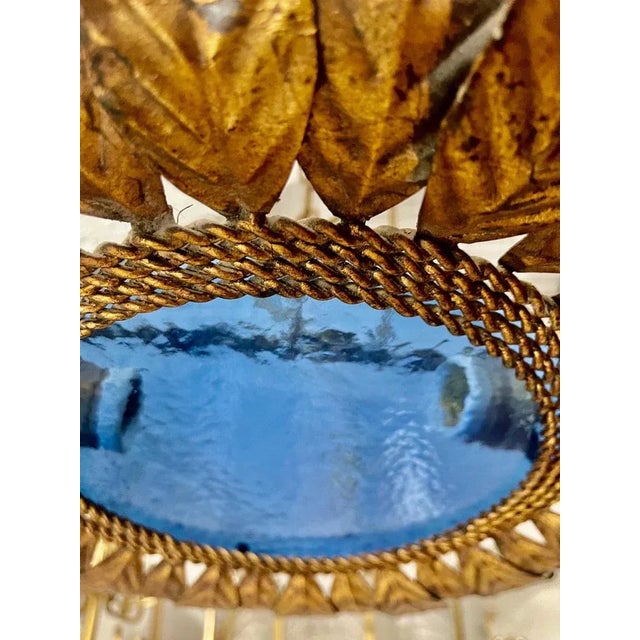 Large Spanish sunburst light in gilt metal and frosted glass, Spain, 1950s. Midcentury antique gilt iron frame or pendant...