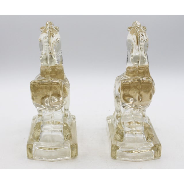 Pair of circa 1930-40s rearing horse glass bookends, L.E. Smith Glass Co. Art Deco-Art Modern. Raised on polygon plinth...