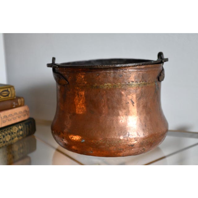 Antique copper coal or log bucket with iron handle, and dovetail joints. Condition is good commensurate with age. Measures...
