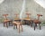 A set of four brutalist chairs made by a french craftsman in the 1960s. these oak and beech chairs feature a thick, solid...