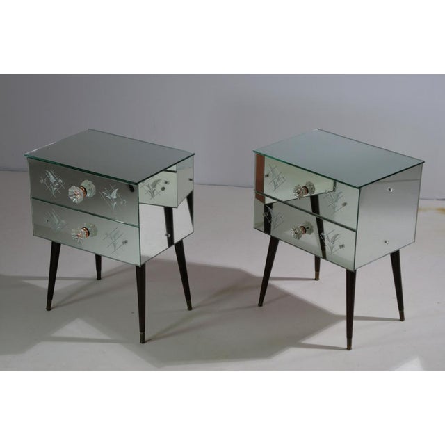 Add a touch of glamour and refinement to your bedroom with this stunning pair of Art Deco-inspired mirrored bedside...
