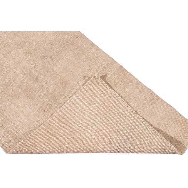 Beautiful vintage Turkish hand-knotted wool rug with a beige field. This rug has tan accents in a gorgeous all-over...