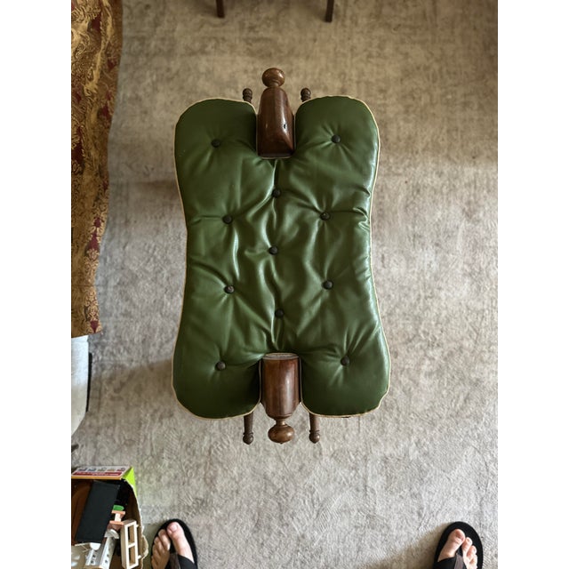 Add a touch of global eclectic charm to your space with this vintage Mid-Century camel saddle footstool. Featuring a...