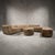 Soft geometry, low proportions, and a warm tobacco-toned finish come together in this one-of-one LOOM modular sectional....