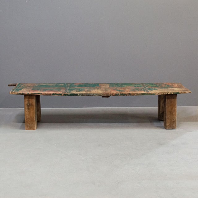 Rustic coffee table made from an antique Indian door, with remnants of old original green and orange paint. The thick 4.5"...