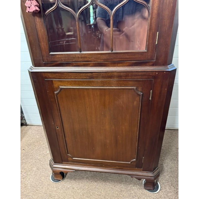 Beautiful Chippendale style mahogany and flame mahogany veneer bench made 2 part corner cupboard. This cupboard was made...