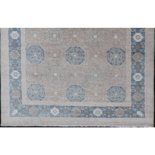 Modern Hand Knotted Khotan in Wool With All-Over Medallion Design in Blue and Earthy Tones For Sale - Image 4 of 13