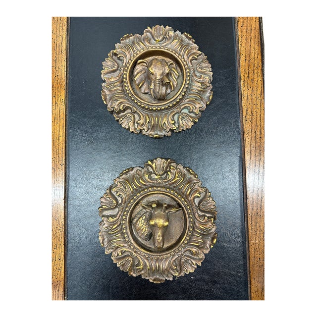 Vintage neo classic wall plaques of an elephant and a giraffe. Lightweight and bronze toned these are perfect wall accents.