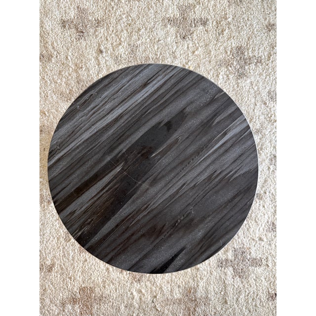 Elevate your space with a masterclass in geometric form. The Elton Round Side Table, sourced from Lulu and Georgia, is a...