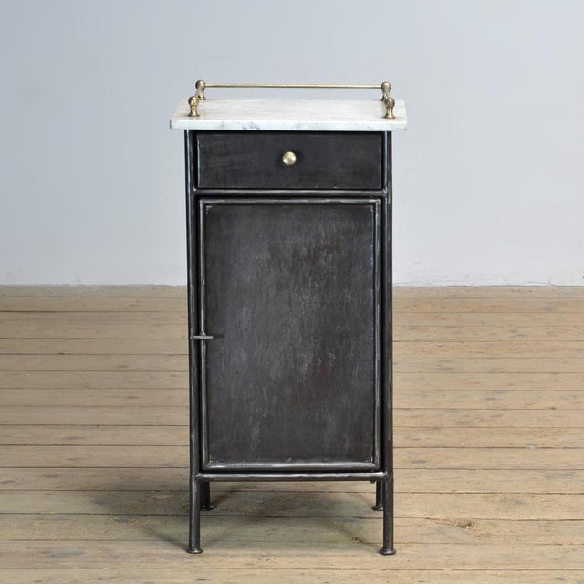 This iron bedside table dates from circa 1920 and exudes character and craftsmanship. The frame has been stripped of old...