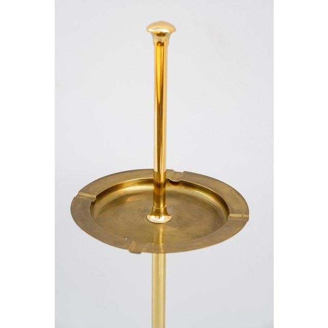 Brass ashtray/pocket emptier, Made in Italy, 1960s. Very elegant floor standing ashtray/emptyer. It is recommended to view...
