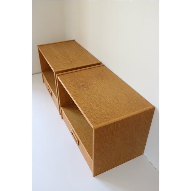 Pair of Scandinavian wall-mounted bedside tables from the 1960s. In excellent condition despite their age. Materials: oak...
