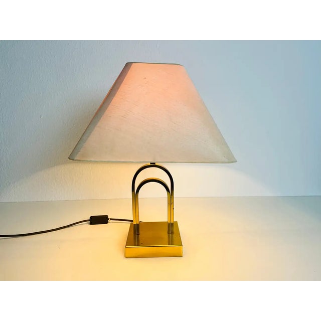 A beautiful large table lamp made in the 1960s. The base is made of solid brass. The lamp shade is made of fabric and has...