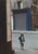 Little Paris Corner View of a child walking on the pavement in the Rue Dauphine, Paris. From the series Paris in Colour,...