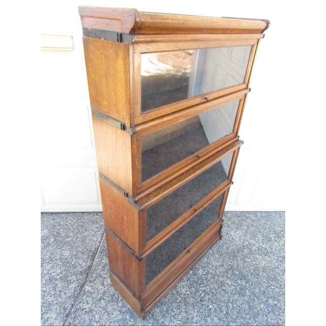 Antique English oak stacking lawyers or barrister bookcase, c.1900. Made by Kenrick and Jefferson, Birmingham, England....
