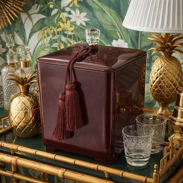 Elevate your home bar with this elegant, generously sized ice bucket. Featuring a rich, deep red lacquered finish, this...